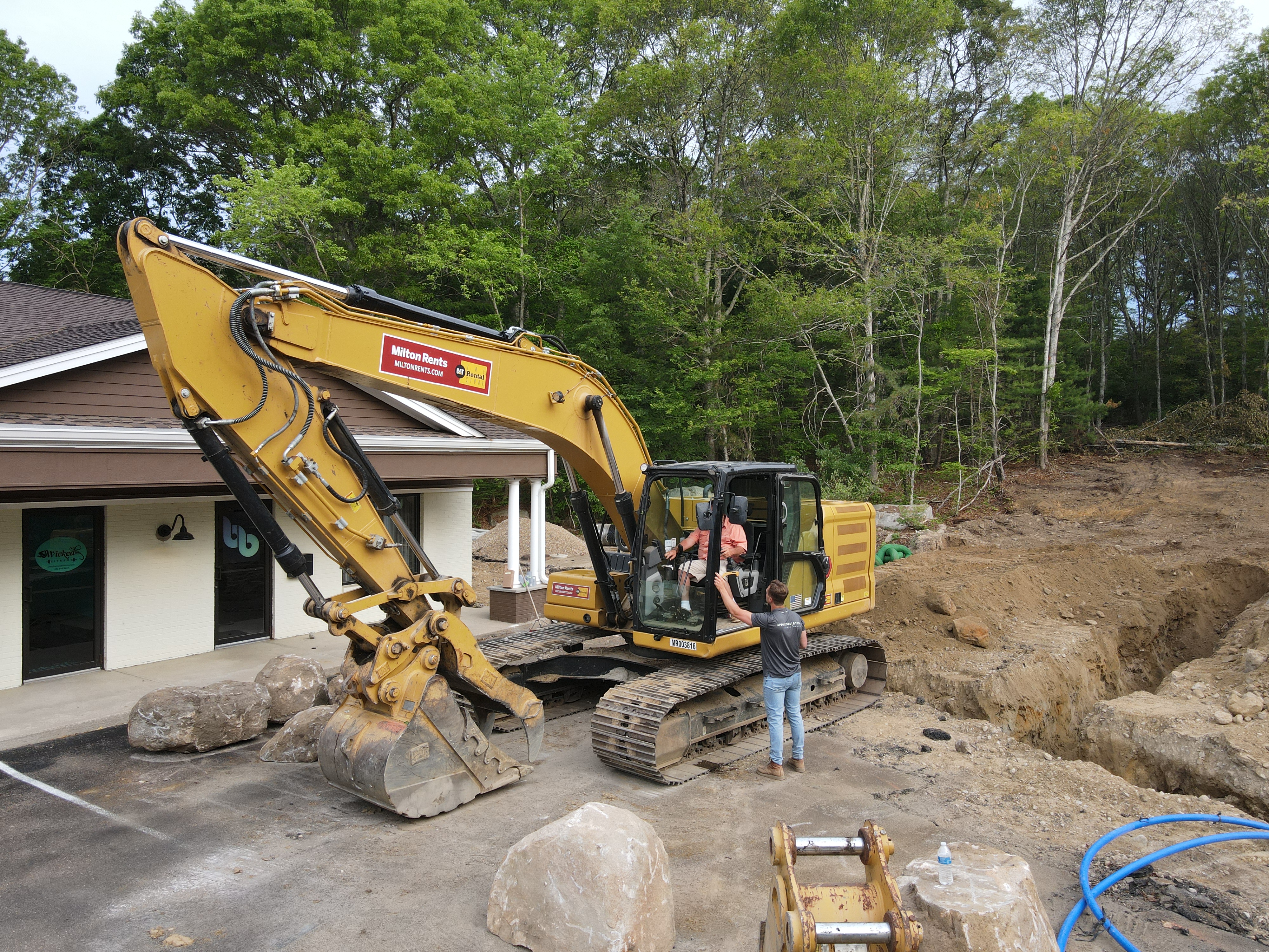 Alex on a live excavation site with ACRE